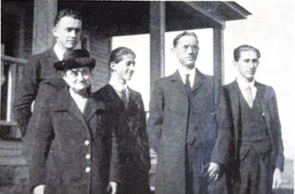 Family portrait showing five people in formal attire